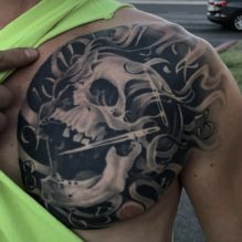 Skull With Nails Tri Pink Tattoo